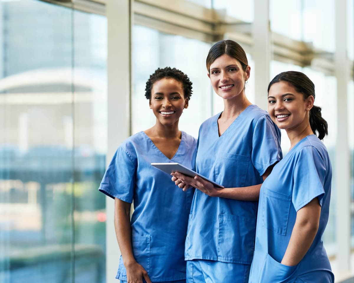 Three nurses working together